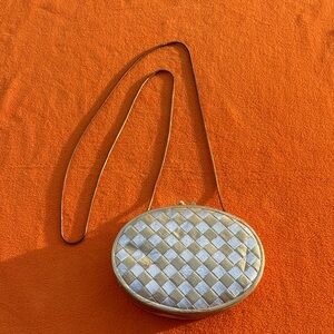 Woven Metallic Silver Oval Crossbody Bag with Gold Trim